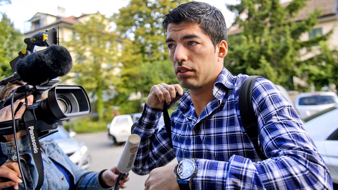 Suarez arrives for appeal hoping to halve four-month suspension